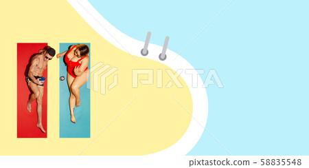 Top view of young caucasian model's resting on beach resort Top view of young caucasian model's resting on beach resort 58835548