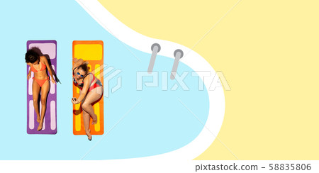 Top view of young caucasian model's resting on beach resort Top view of young caucasian model's resting on beach resort 58835806