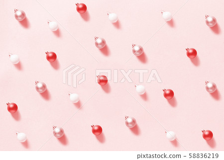 Christmas baubles on a light pink background Christmas baubles on a light pink background 58836219