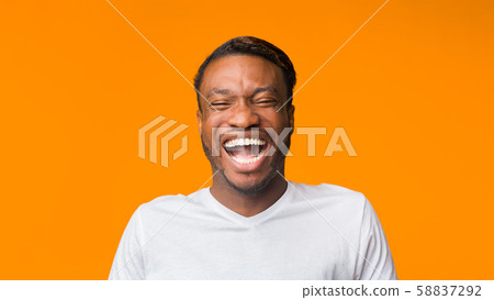 African American Guy Laughing Standing Over Orange Background, Panorama 58837292