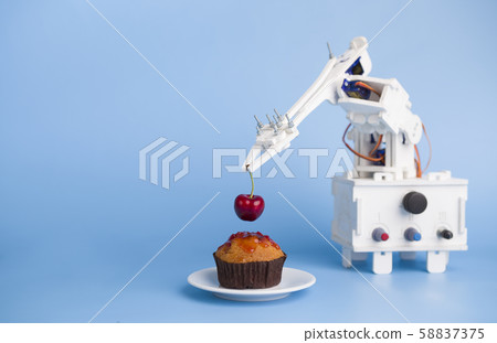 AI assistant preparing cupcake at kitchen, blue background AI assistant preparing cupcake at kitchen, blue background 58837375