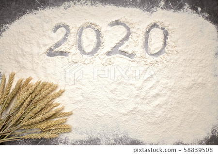 Happy New Year 2020. Symbol from number 2020 and wheat on farina background 58839508