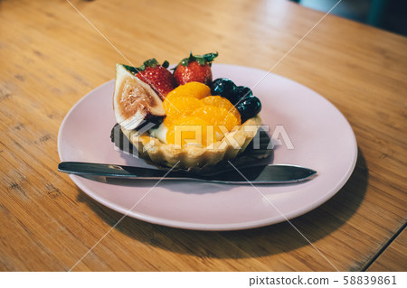 Close up of fruit tart on the wooden table. 58839861