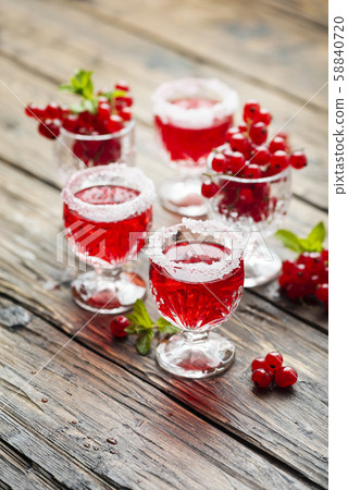 Red currant liquor with sugar and mint 58840720