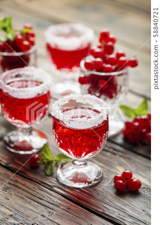 Red currant liquor with sugar and mint Red currant liquor with sugar and mint 58840721