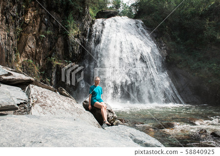 Woman at Korbu Waterfall Woman at Korbu Waterfall 58840925