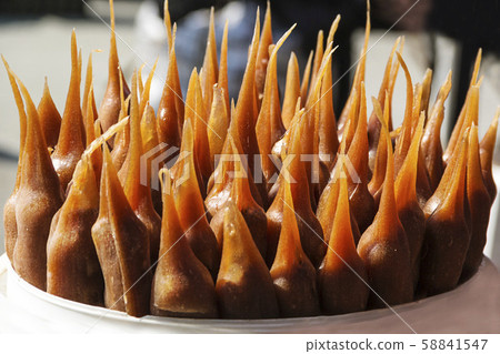 Churchkhela is an ancient Georgian national sweetness, a favorite delicacy Churchkhela is an ancient Georgian national sweetness, a favorite delicacy 58841547