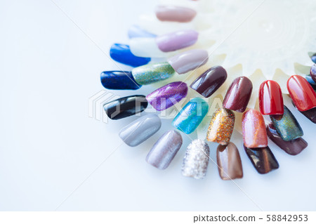 Palette of nail polish for manicure on white 58842953