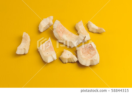 ugly organic broken rotten coconut on bright 58844315