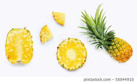 Fresh whole and cut pineapple isolated on white Fresh whole and cut pineapple isolated on white 58844910