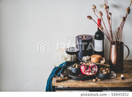 Red wine and different snacks on wooden board Red wine and different snacks on wooden board 58845852