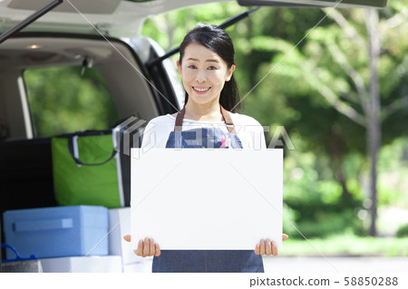 A woman with a message board A woman with a message board 58850288