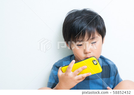 Boy smartphone 58852432