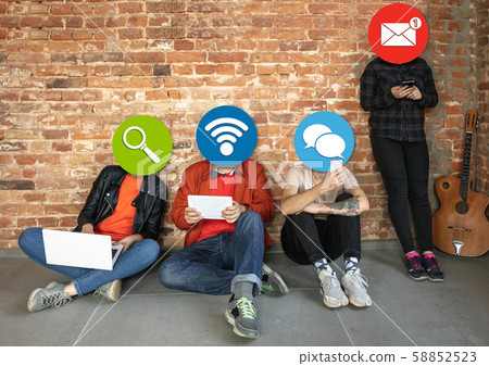 Creative millenial people connecting and sharing social media. Modern UI icons as heads Creative millenial people connecting and sharing social media. Modern UI icons as heads 58852523