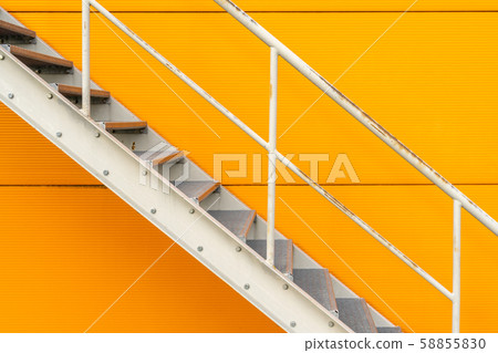 Steel stairs are on the side of the building wall Steel stairs are on the side of the building wall 58855830