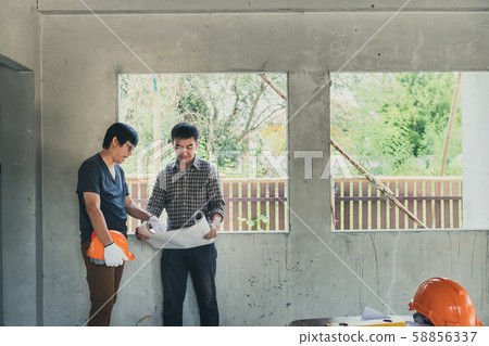 Engineer and architect discussing with foreman about project in building construction site Engineer and architect discussing with foreman about project in building construction site 58856337