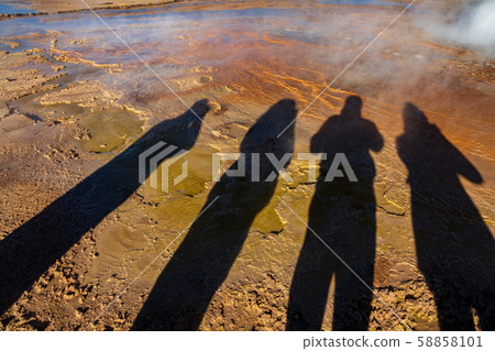 Tourist shadows near geyser with bright colors Tourist shadows near geyser with bright colors 58858101