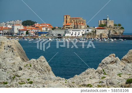 Castro Urdiales downtown and cathedral framed with rocks Castro Urdiales downtown and cathedral framed with rocks 58858106