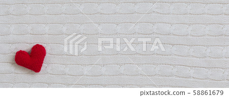 White woolen sweater background with knitted red White woolen sweater background with knitted red 58861679