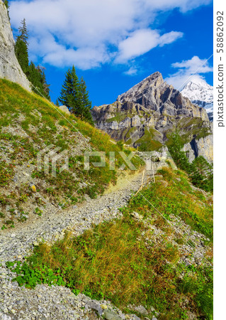 Bernese Alps footpath, snow mountains, Switzerland Bernese Alps footpath, snow mountains, Switzerland 58862092