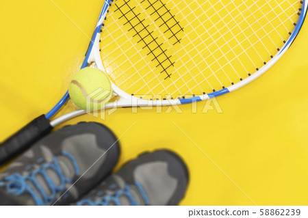 Tennis on a bright background, racket, ball Tennis on a bright background, racket, ball 58862239
