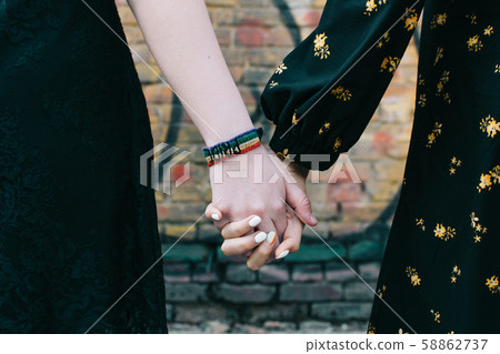 Two woman LGBT hand close up 58862737