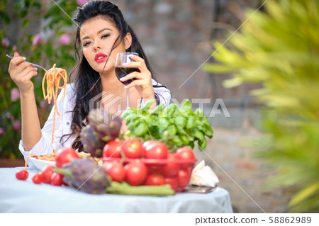 beautiful Woman in summer dress eats Italy beautiful Woman in summer dress eats Italy 58862989