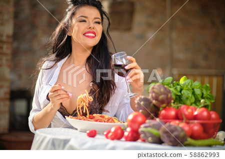 beautiful Woman in summer dress eats Italy beautiful Woman in summer dress eats Italy 58862993