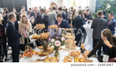 Abstract blured photo of business people socializing during banquet lunch break break at business 58863067