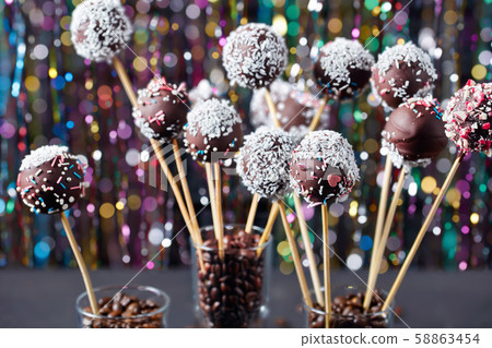 chocolate cake pops with colorful bokeh background 58863454