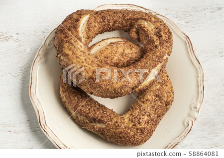 crispy Turkish bagel, simit on a wooden table crispy Turkish bagel, simit on a wooden table 58864081