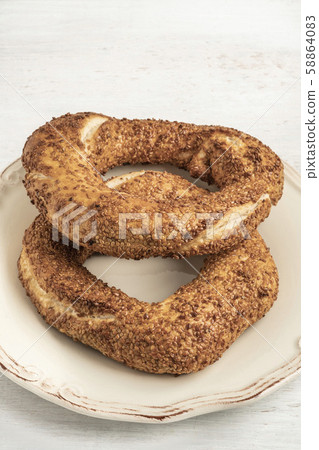 crispy Turkish bagel, simit on a wooden table crispy Turkish bagel, simit on a wooden table 58864083