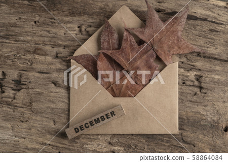 template for december with dried leaves on wooden 58864084
