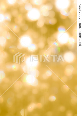Blur yellow gold bokeh background of reflective glittering light from holiday party crystal ball chandelier Blur yellow gold bokeh background of reflective glittering light from holiday party crystal ball chandelier 58864669