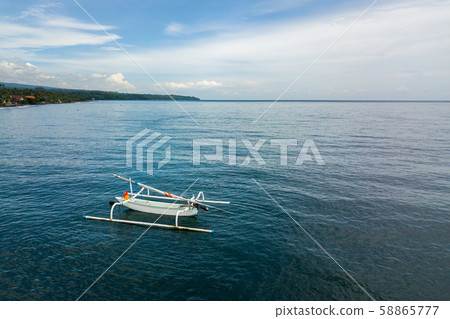Aerial view of a traditional fishing boat in Bali, Aerial view of a traditional fishing boat in Bali, 58865777