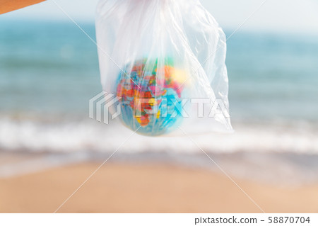 Environment pollution concept. Woman holds in her 58870704