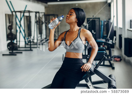 A beautiful black girl is engaged in a gym A beautiful black girl is engaged in a gym 58873089
