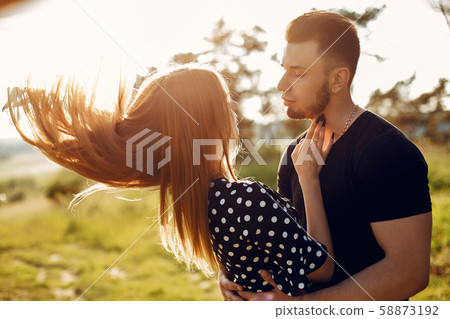Beautiful couple spend time in a summer park 58873192