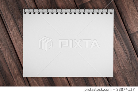 Blank ring bound scrap book on a rustic wooden background in horizontal orientation with copy space 58874137