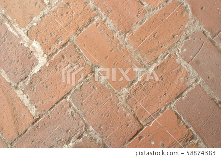 The image of a fragment of an ancient brick floor as a background 58874383