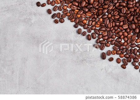 Coffee beans isolated on a grey concrete background. Coffee beans isolated on a grey concrete background. 58874386