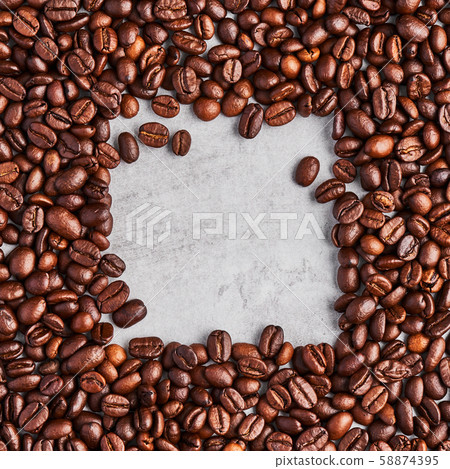 Coffee beans isolated on a grey concrete background. 58874395