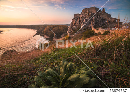 Ruin of a Castle on a Rock at Sunset 58874787