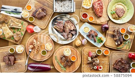 Barbecue restaurant menu. Many different food on the table. Dinner party or Banquet. Top view Barbecue restaurant menu. Many different food on the table. Dinner party or Banquet. Top view 58875094