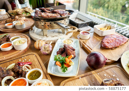 Barbecue restaurant menu. Many different food on the table. Dinner party or Banquet. Barbecue restaurant menu. Many different food on the table. Dinner party or Banquet. 58875177