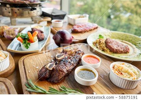 Beef meat cut according to the Argentine style, called asado. Barbecue restaurant menu. Many 58875191