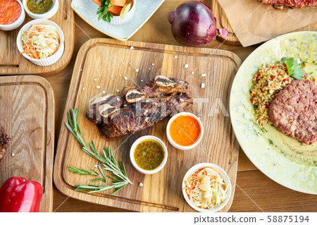 Beef meat cut according to the Argentine style, called asado. Barbecue restaurant menu. Many 58875194