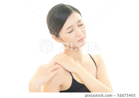 Women complaining of stiff shoulders Women complaining of stiff shoulders 58875405