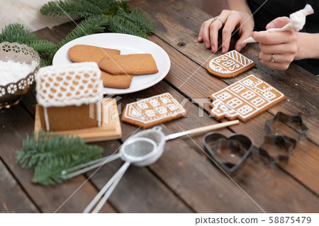 Christmas homemade gingerbread cookies on wooden table. Icing of Christmas bakery. closeup, copy 58875479