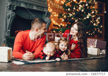 Family sitting at home near christmas tree 58877717